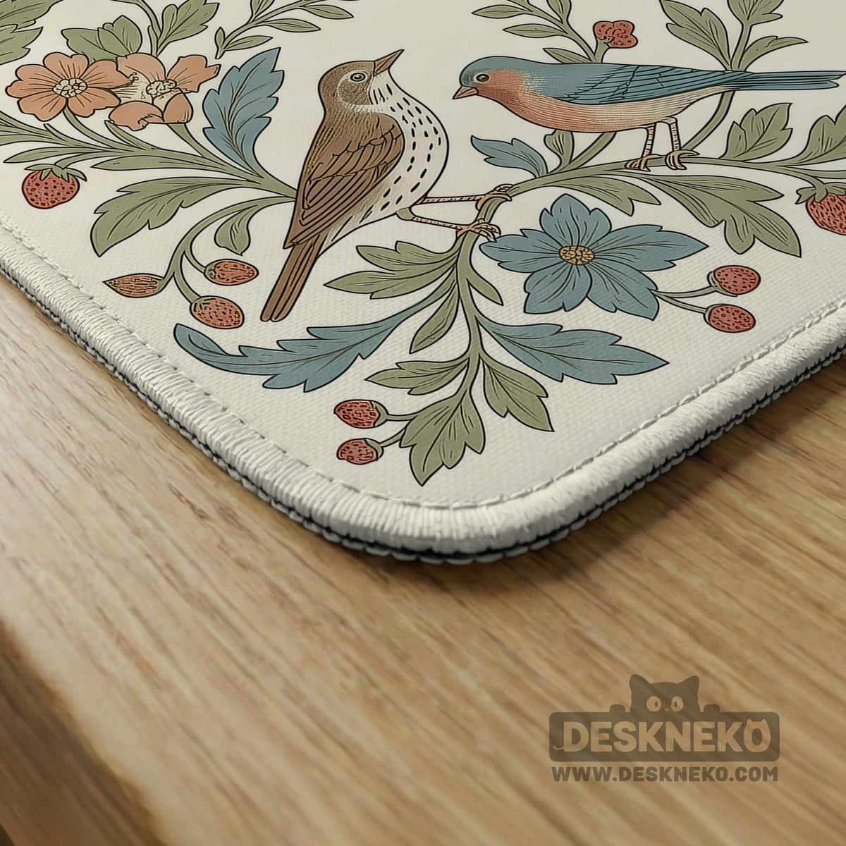 Square mahjong mat with a cream background, blue birds, sage leaves, terracotta flowers, and a decorative botanical border with printed rules text.