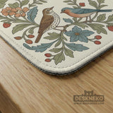 Square mahjong mat with a cream background, blue birds, sage leaves, terracotta flowers, and a decorative botanical border with printed rules text.