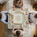 Square mahjong mat with a cream background, blue birds, sage leaves, terracotta flowers, and a decorative botanical border with printed rules text.