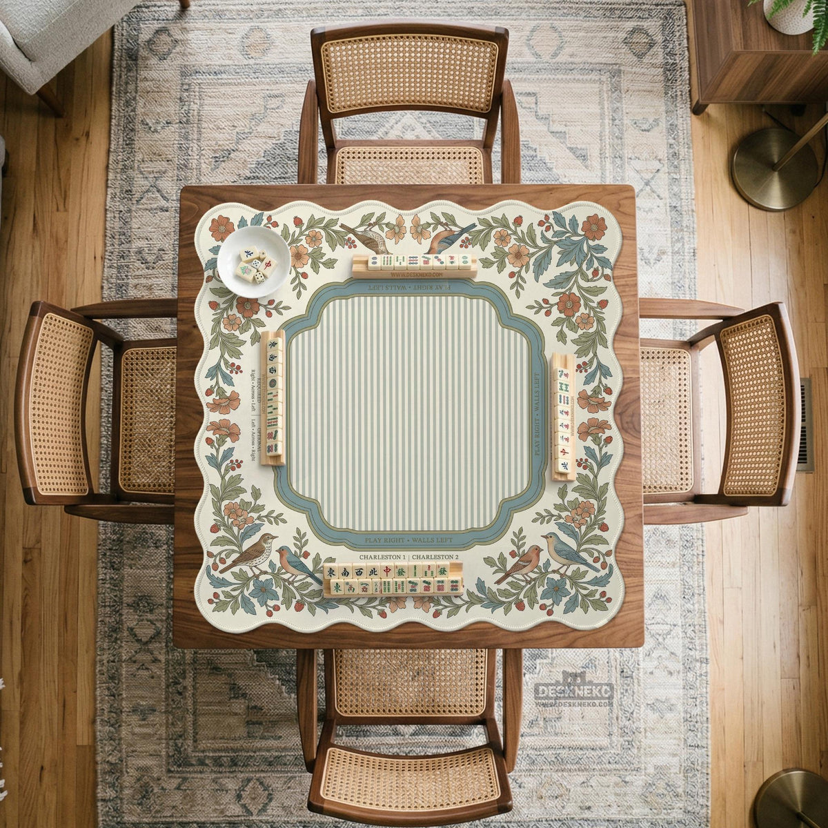 Square mahjong mat with a cream background, blue birds, sage leaves, terracotta flowers, and a decorative botanical border with printed rules text.