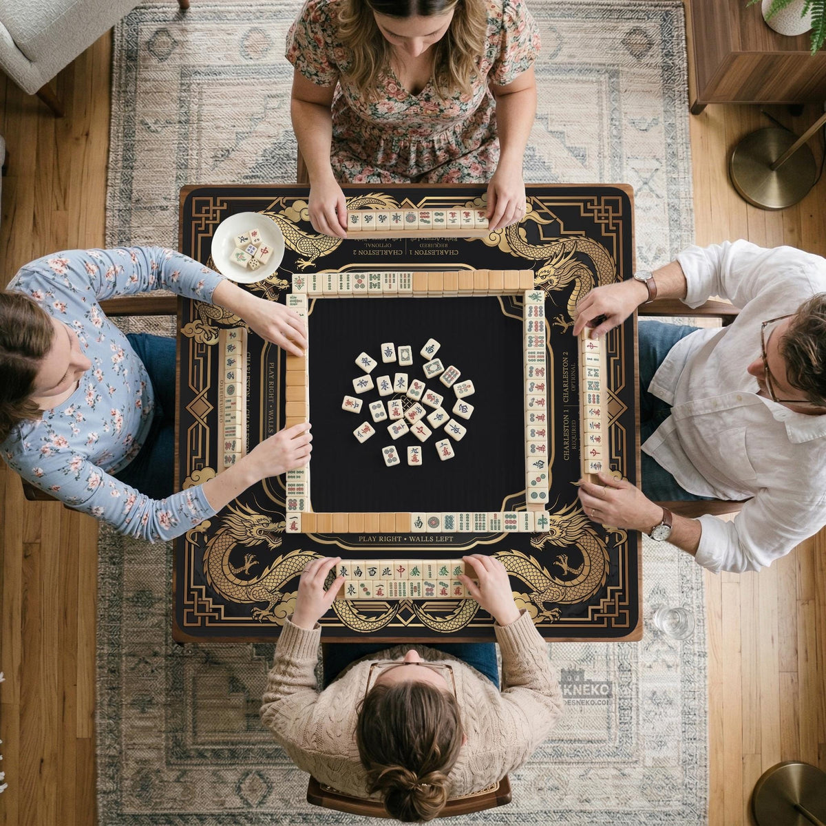 Black mahjong mat with gold dragon artwork, a scalloped edge, and printed Mahjong rules on the surface.