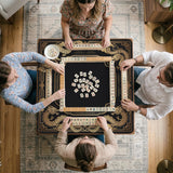 Black mahjong mat with gold dragon artwork, a scalloped edge, and printed Mahjong rules on the surface.