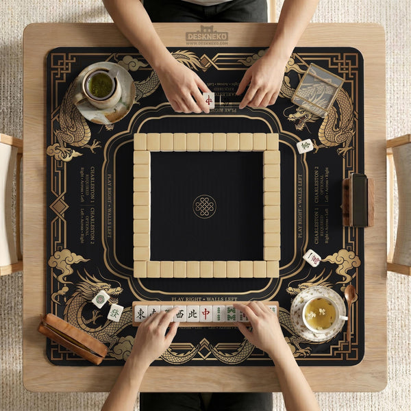 Black mahjong mat with gold dragon artwork, a scalloped edge, and printed Mahjong rules on the surface.