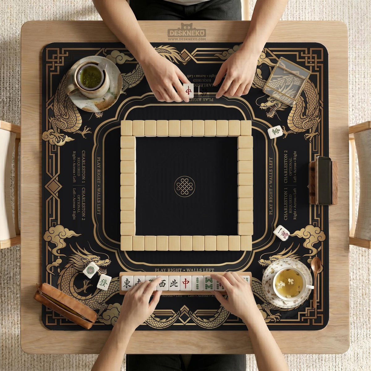Black mahjong mat with gold dragon artwork, a scalloped edge, and printed Mahjong rules on the surface.