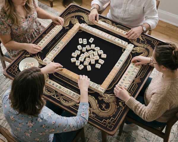 Black mahjong mat with gold dragon artwork, a scalloped edge, and printed Mahjong rules on the surface.