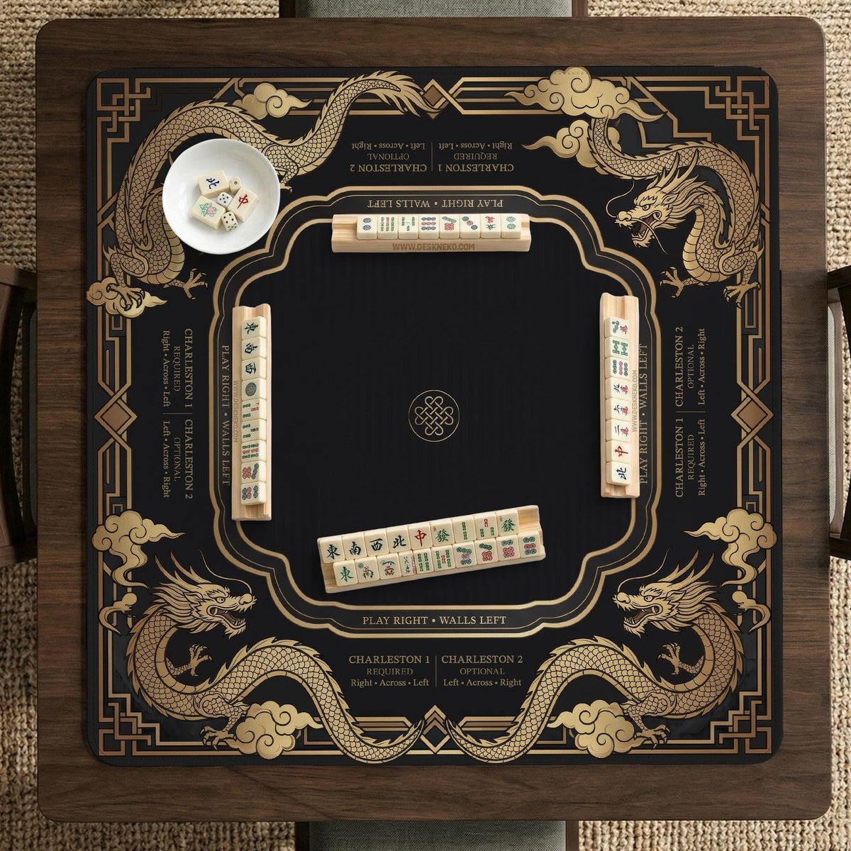 Black mahjong mat with gold dragon artwork, a scalloped edge, and printed Mahjong rules on the surface.
