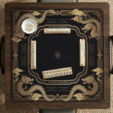Black mahjong mat with gold dragon artwork, a scalloped edge, and printed Mahjong rules on the surface.