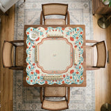 Cream mahjong mat with a coral and teal floral border, rule layout text, Charleston guide notes, and a blank center area for tile play.