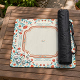 Cream mahjong mat with a coral and teal floral border, rule layout text, Charleston guide notes, and a blank center area for tile play.