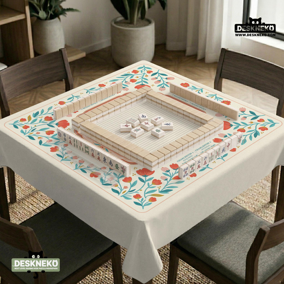 Cream mahjong mat with a coral and teal floral border, rule layout text, Charleston guide notes, and a blank center area for tile play.