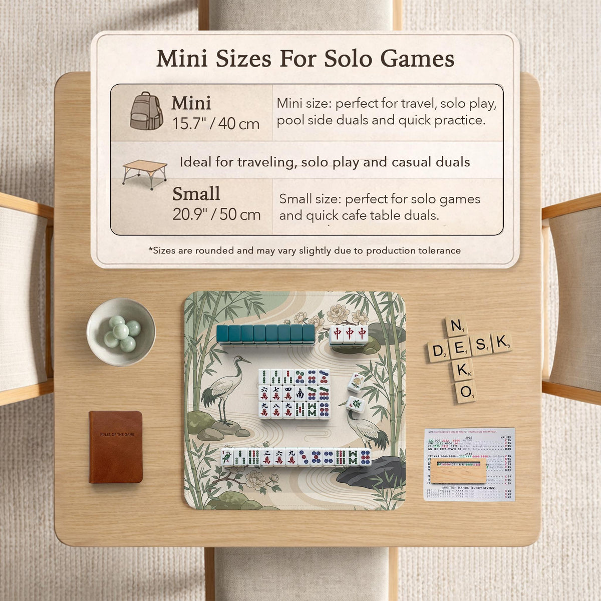 Square mahjong mat with a cream background, sage green cranes, bamboo leaves, peony branches, stones, and thin linework.