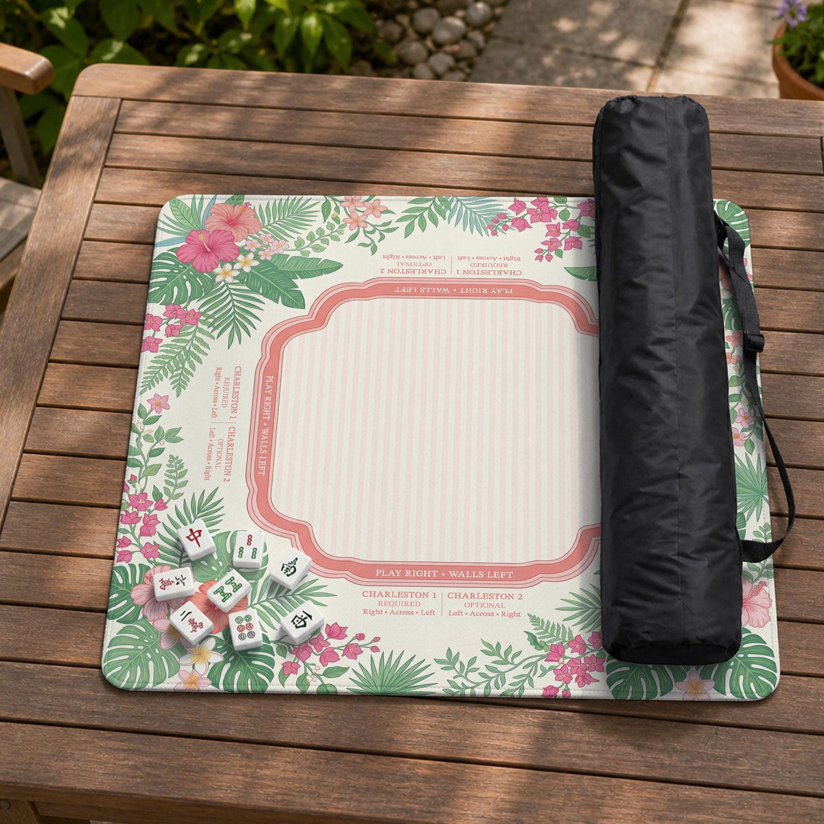 Coral tropical floral mahjong mat with hibiscus flowers, palm leaves, cream sections, and a scalloped edge.