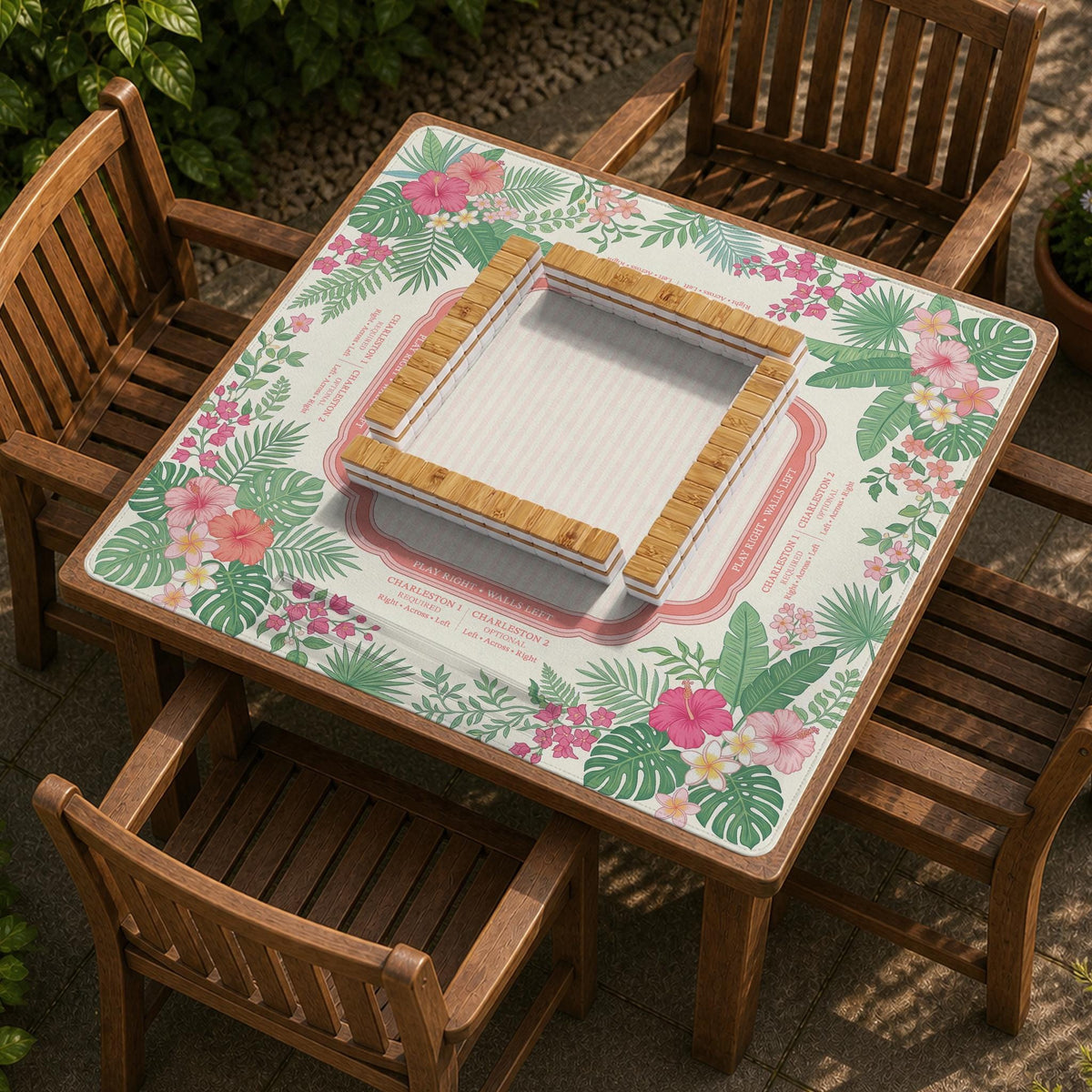 Coral tropical floral mahjong mat with hibiscus flowers, palm leaves, cream sections, and a scalloped edge.