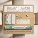 Coral tropical floral mahjong mat with hibiscus flowers, palm leaves, cream sections, and a scalloped edge.