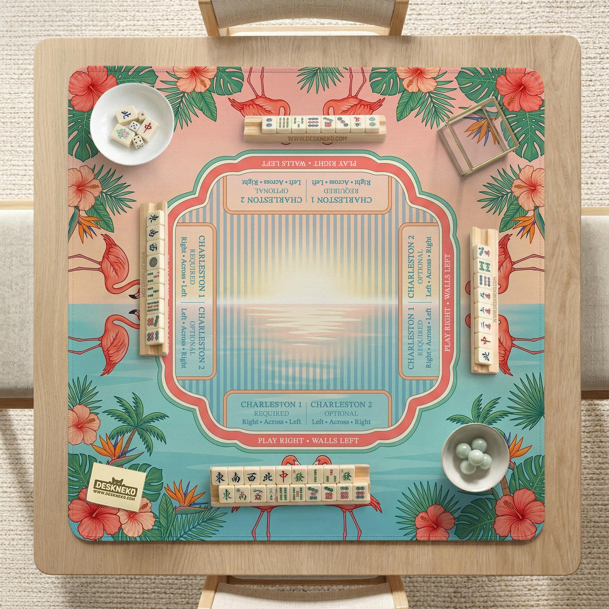 Pink mahjong mat with flamingos, palm leaves, hibiscus flowers, and aqua tropical background.