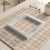 Beige plaid mahjong mat with a cream tartan pattern on a neutral background.
