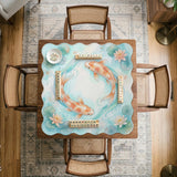 A soft blue mahjong mat with koi fish, floating lily pads, pale floral details, and a watercolor-style pond design.