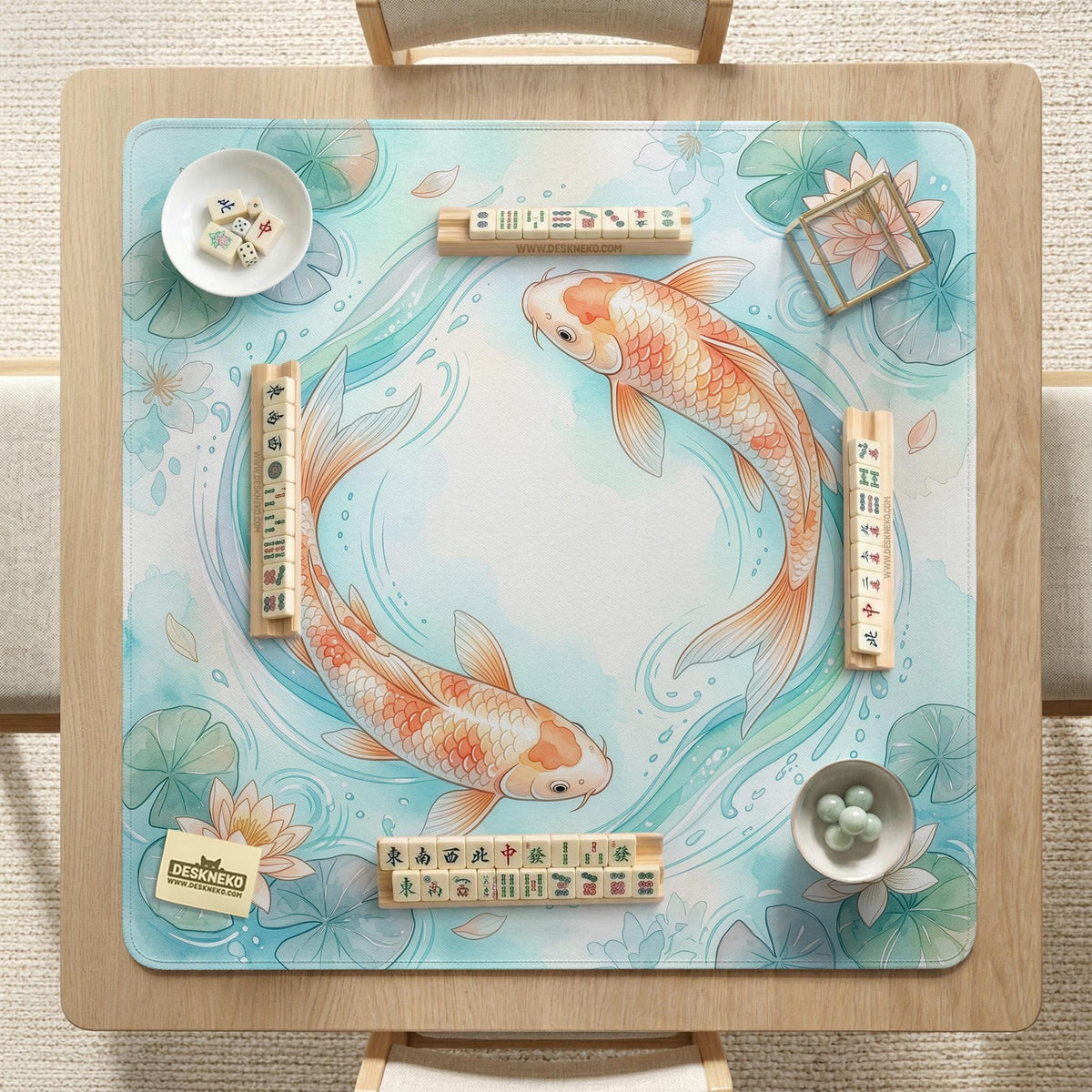A soft blue mahjong mat with koi fish, floating lily pads, pale floral details, and a watercolor-style pond design.
