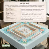 A soft blue mahjong mat with koi fish, floating lily pads, pale floral details, and a watercolor-style pond design.