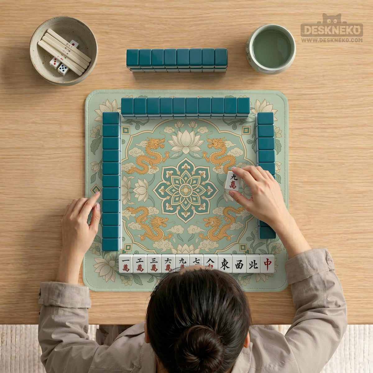 Sage green square mahjong mat with lotus flowers, golden dragons, and an ornamental center design.
