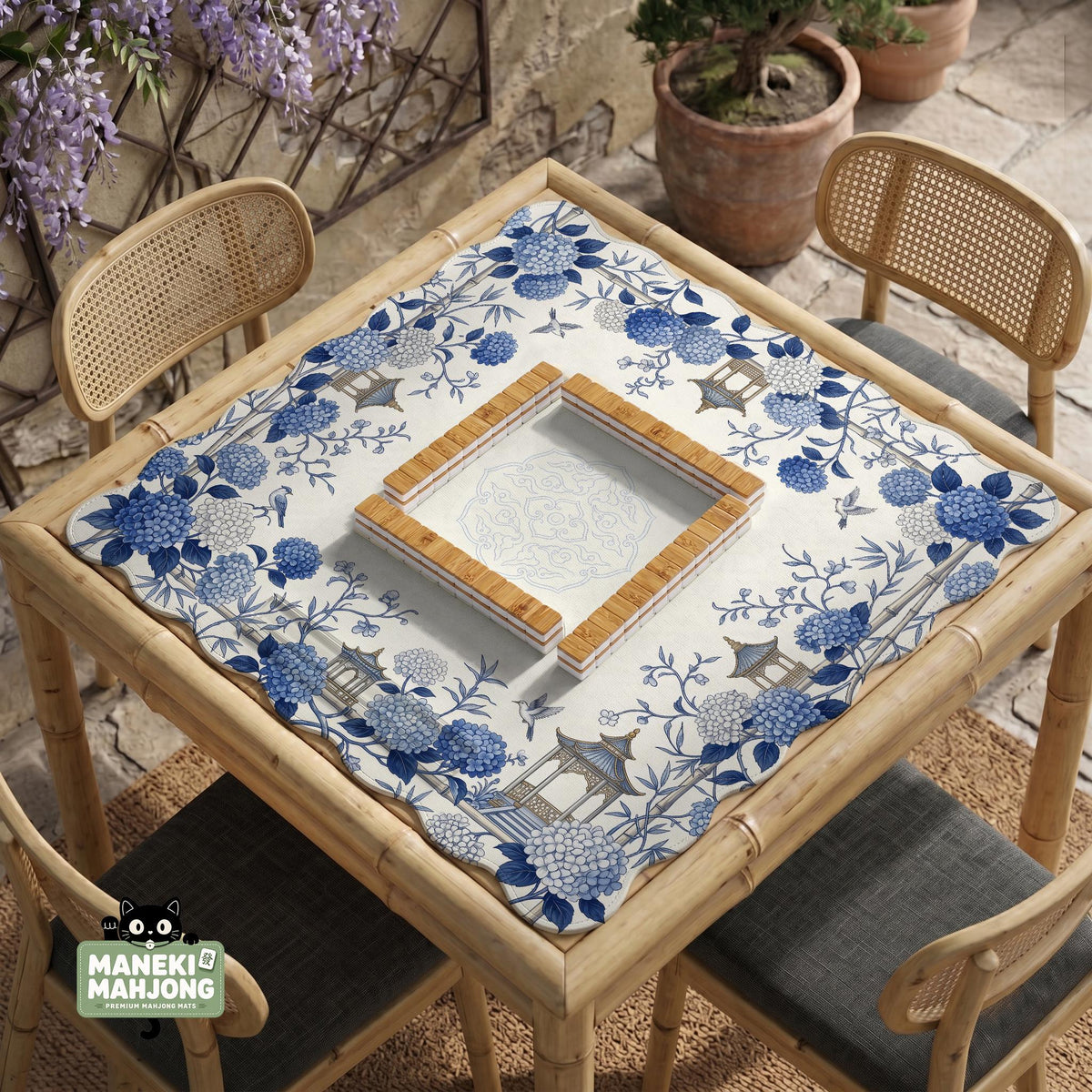 Blue and white square mahjong mat with a hydrangea and bird botanical border and a plain center area.