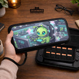 A Switch carrying case design with a cute green alien at a gaming desk, glowing cyan lights, and pastel stars on a dark background.
