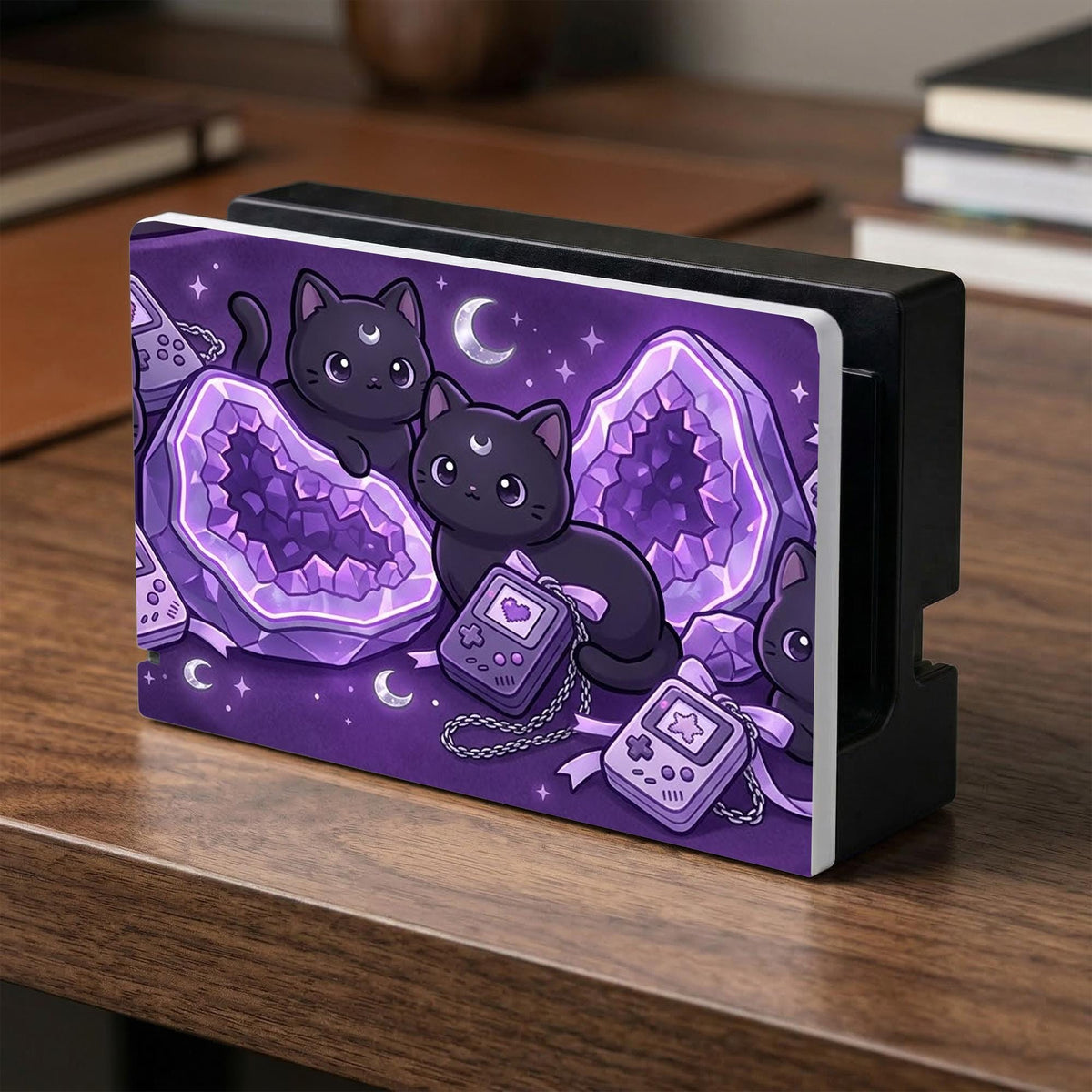 Purple carrying case with black cat faces, moon shapes, stars, and crystal geode style artwork for Nintendo Switch.