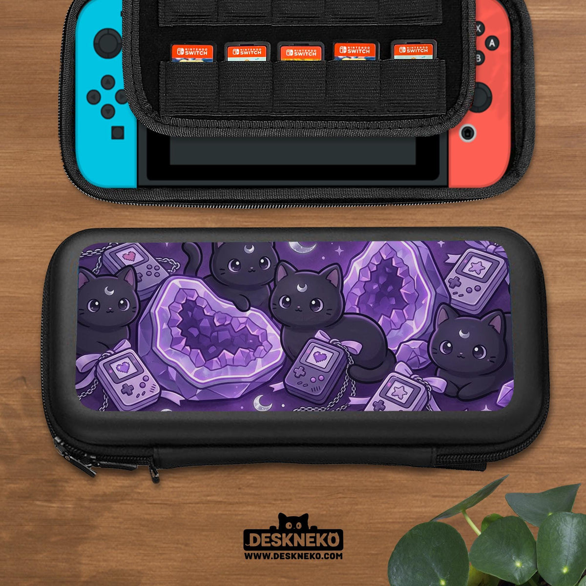 Purple carrying case with black cat faces, moon shapes, stars, and crystal geode style artwork for Nintendo Switch.