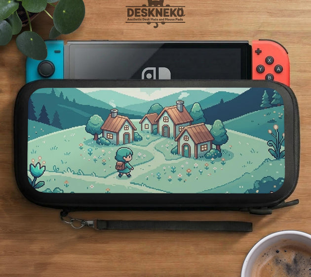 Teal carrying case with a pixel-style village scene, small houses, layered mountains, flowers, and a retro game-inspired landscape design.