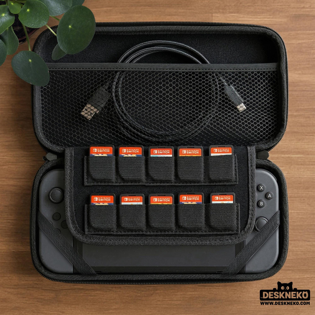 Teal carrying case with a pixel-style village scene, small houses, layered mountains, flowers, and a retro game-inspired landscape design.
