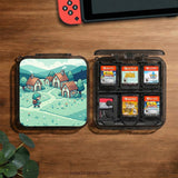 Teal carrying case with a pixel-style village scene, small houses, layered mountains, flowers, and a retro game-inspired landscape design.