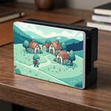 Teal carrying case with a pixel-style village scene, small houses, layered mountains, flowers, and a retro game-inspired landscape design.