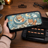 Blue Switch carrying case with cute fox characters, moon and star details, and small potted plants with beige accents.