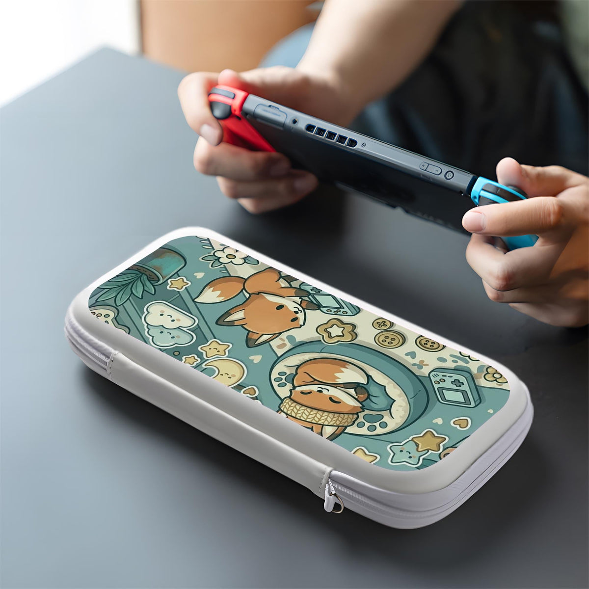 Blue Switch carrying case with cute fox characters, moon and star details, and small potted plants with beige accents.