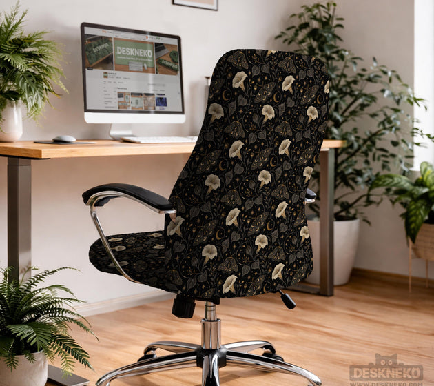 Black chair cover with a moth, moon, and flower pattern in gold, ivory, and dark botanical tones.