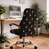 Black chair cover with a moth, moon, and flower pattern in gold, ivory, and dark botanical tones.