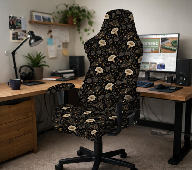 Black chair cover with a moth, moon, and flower pattern in gold, ivory, and dark botanical tones.