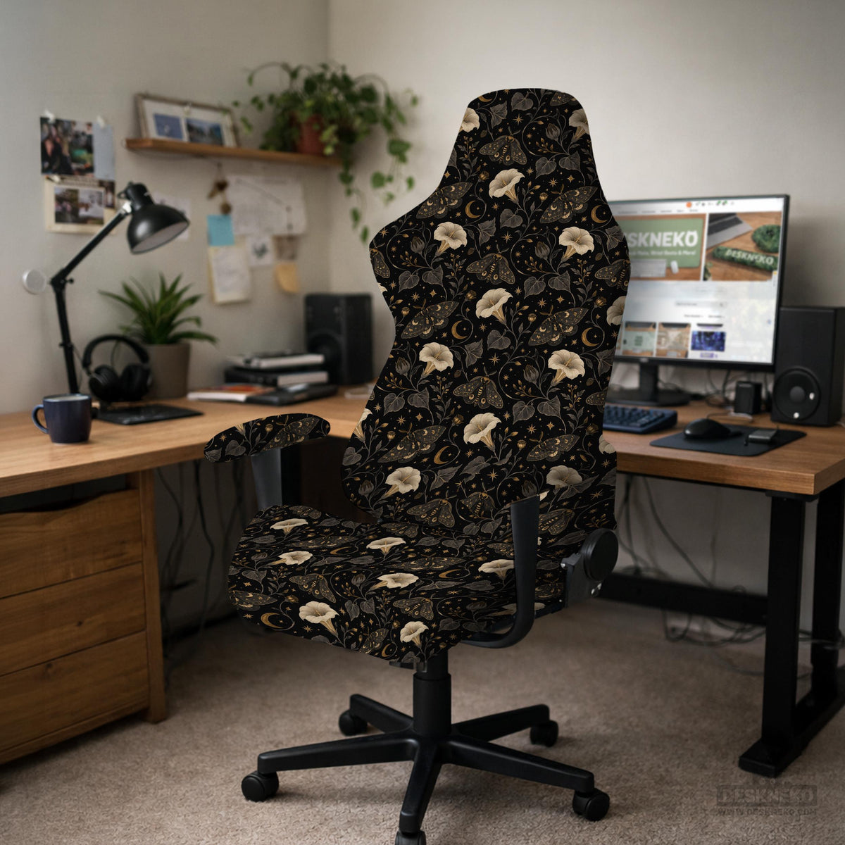 Black chair cover with a moth, moon, and flower pattern in gold, ivory, and dark botanical tones.
