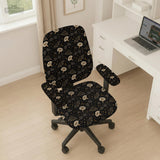Black chair cover with a moth, moon, and flower pattern in gold, ivory, and dark botanical tones.