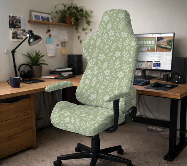Sage green desk chair cover with a small floral and leaf print shown on an office chair.