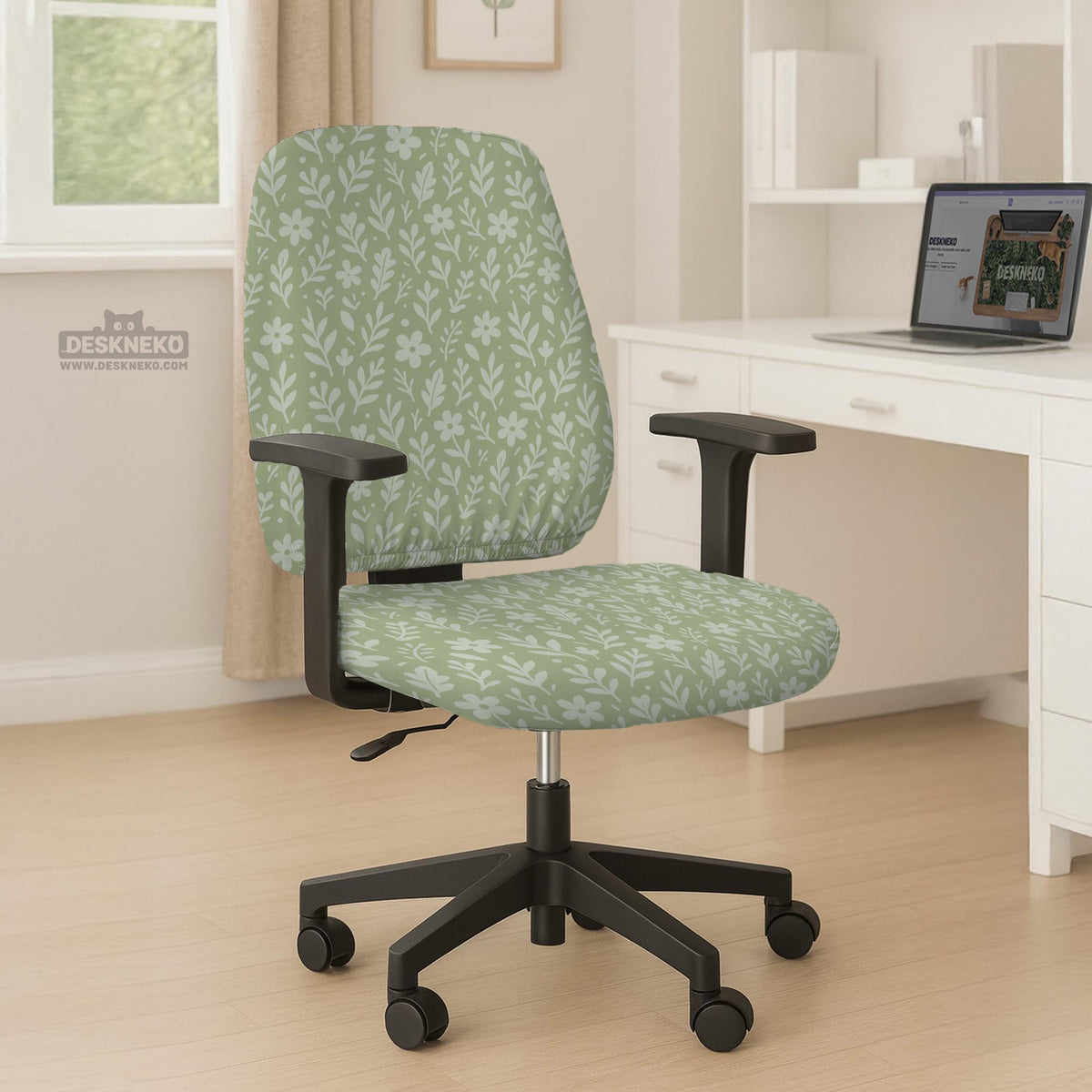 Green chair cover with a small botanical floral print in sage and cream.