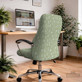 Sage green desk chair cover with a small floral and leaf print shown on an office chair.