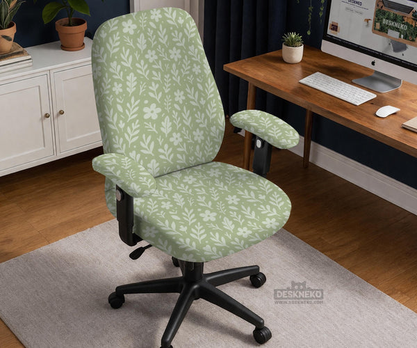 Sage green desk chair cover with a small floral and leaf print shown on an office chair.
