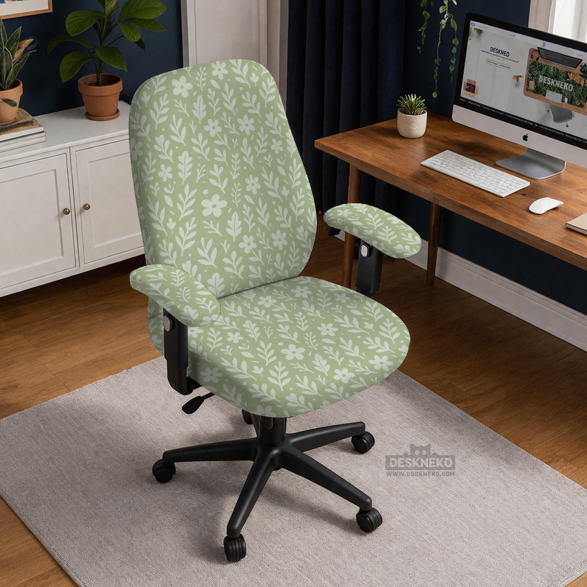 Green chair cover with a small botanical floral print in sage and cream.
