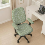 Green chair cover with a small botanical floral print in sage and cream.