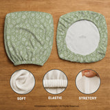 Sage green desk chair cover with a small floral and leaf print shown on an office chair.