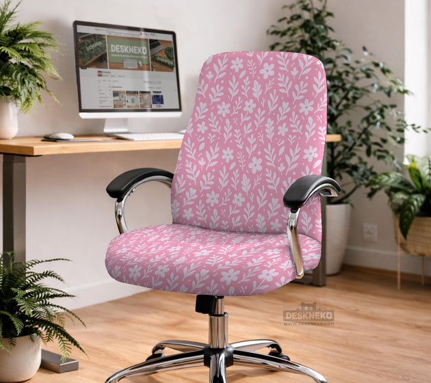 Blush pink chair cover with a small botanical floral pattern shown on an office chair.