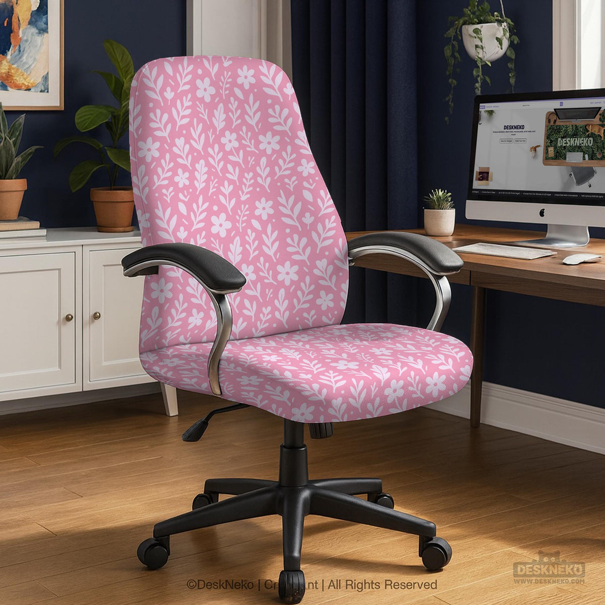 Blush pink chair cover with a small botanical floral pattern shown on an office chair.