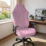 Blush pink chair cover with a small botanical floral pattern shown on an office chair.