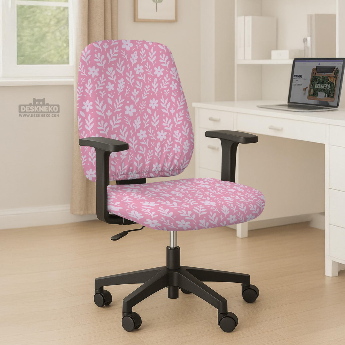 Soft pink floral chair cover shown on a gaming chair with a high back and armrests.